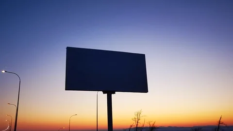 Banner by the road on the background of the evening sky. 库存影片 124032896