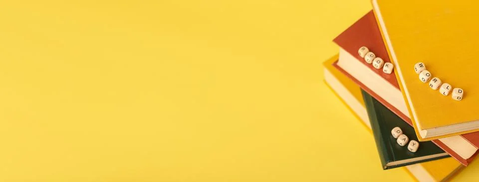 Banner with a stack of books and text World Book Day. Copy space Stock Photos