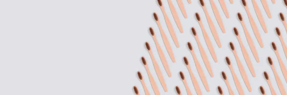 Banner with toothbrushes pattern on a blue background. Stock Photos