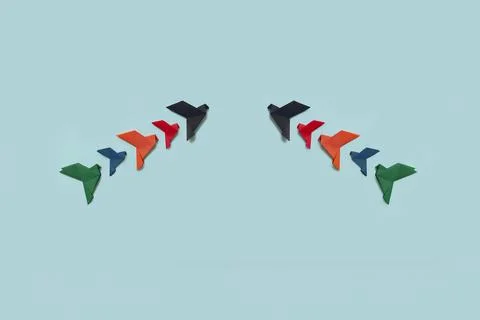 Banner two groups of five paper origami pigeons lack, red, orange, blue and.. Stock Photos
