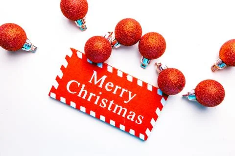 Banner on white background surrounded by red balloons on which he writes merr Stock Photos