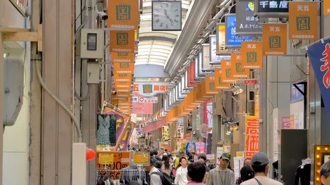 Banners hanging on the side of the stores in Osaka Japan Stock Footage 129274940