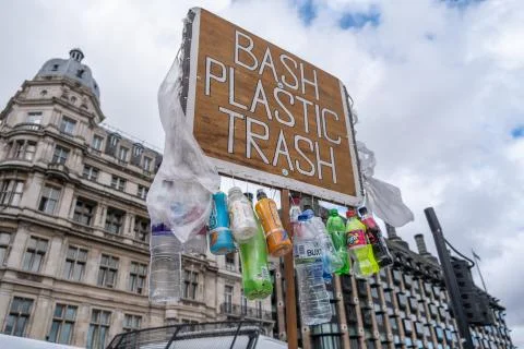 Banners protesting the use of plastic in front of buildings in London Stock Photos