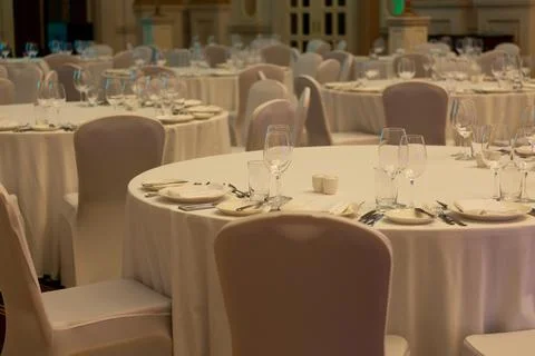 Banquet hall in the restaurant with table setting Stock Photos