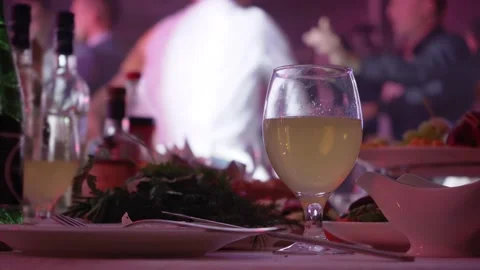 Banquet table with dancing in the background 動画素材 200836710