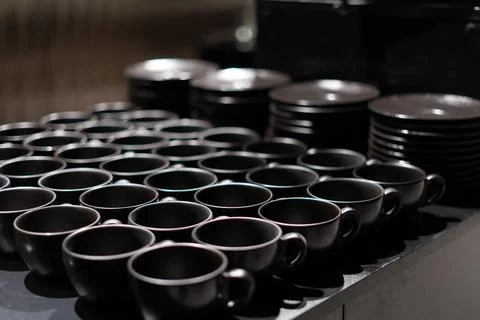 Banquet, table full of empty cups and plates. Formal dinner, ready to serve Stock Photos