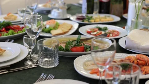 Banquet table, there are different dishes at the celebration Stock Footage 331524244