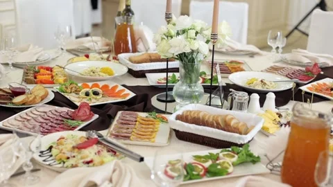 Banquet table, there are different dishes at the celebration Stock Footage 331524247
