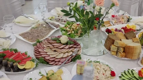 Banquet table, there are different dishes at the celebration Stock Footage 331524248