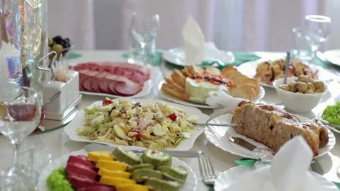Banquet table, there are different dishes at the celebration Stock Footage 331524250