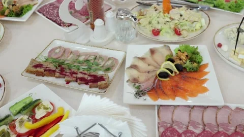 Banquet table, there are different dishes at the celebration Stock Footage 331524256