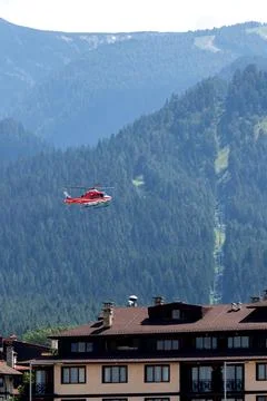 Bansko, Bulgaria - July 8, 2026: Red emergency medical service helicopter fly Fotos de archivo