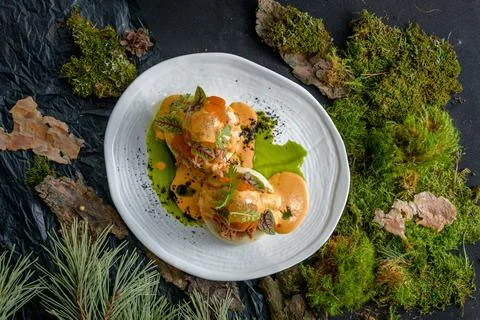 Bao with pulled beef, pumpkin sauce and arugula Stock Photos