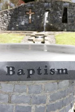 Baptism inscribed on a granite table Stock Photos