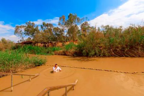 Baptism in the River Jordan. Stock Photos