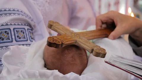 Baptizing an infant with a christ Stock Footage 118016196