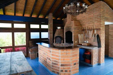 Bar-b-q area in backyard of mountain home in nature Stock Photos