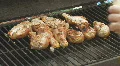Bar-B-Q Chicken on the grill with flames clip 4 HD Footage