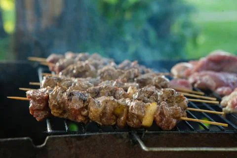 Bar-B-Q or BBQ with kebab cooking. Coal grill of pork skewers with tomatoes Stockfoto's