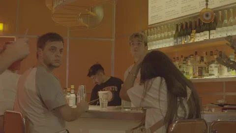 A bar in Buenos Aires, Argentina, with a bartender and customers Video stock 345138195