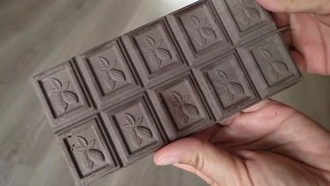 A bar of chocolate with a white coating Stock Footage 282304605