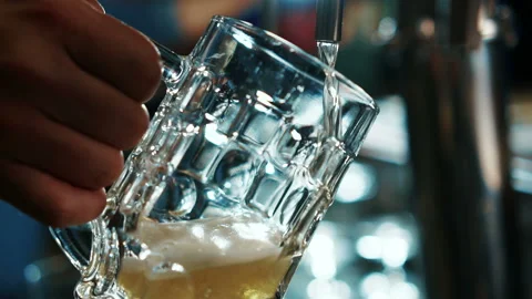In the bar, close-up, a light beer is poured into the mug. Stock Footage 91192820