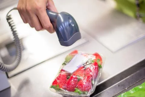Bar code reader in a supermarket. Stock Photos
