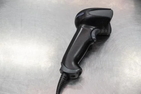The bar code scanner is placed in a stainless steel Foto stock