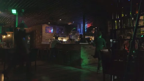 Bar counter in a dark half-empty cafe or pub Stock Footage 121994892