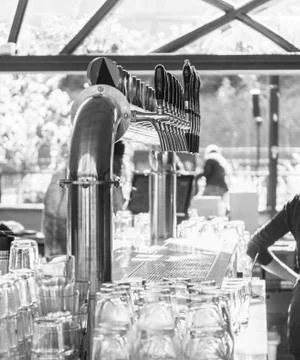 Bar counter draft beer during working hours. close up. BW Foto stock