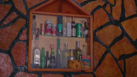 Bar counter with various alcoholic drinks on display. Stock Footage 296377190