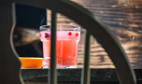 Bar menu hot fruit tea with orange slices, cinnamon and berries on a stone bo Stock Photos