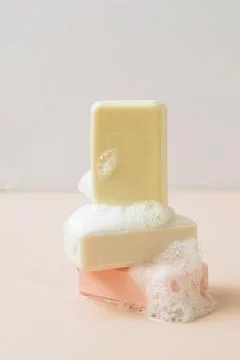 A bar of organic handmade soap with large bubbles of foam. Health beauty natural Stock Photos