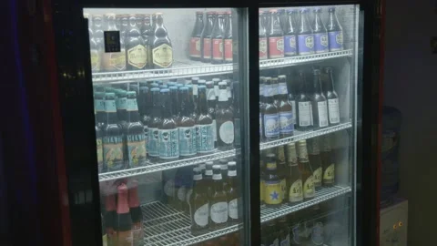 Bar Refrigerator Stocked With Assorted Bottled Drinks in Beijing, China Stock Footage 345751668