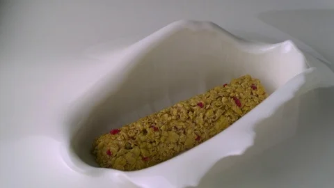   Bar from serial and barries go into yogurt bath 1f Stock-Footage 81823491