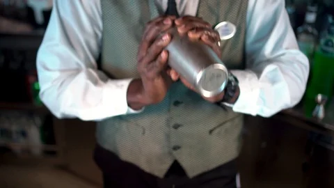 Bar server mixes drink in shaker, Sex in the Ocean cocktail Stock Footage 120314978