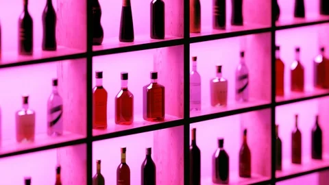 Bar shelf with bottles of different liquors. Alcohols collection. Loopable. 4KHD Stock Footage 119986653