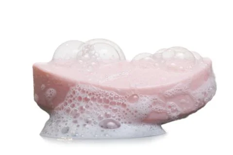 Bar of soap with suds Foto stock