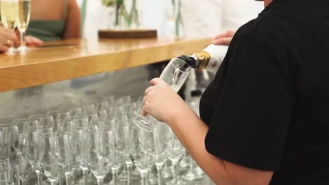 Bar staff pouring champagne at function Stock Footage 151225487