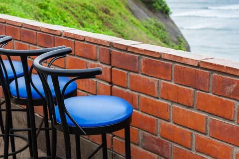 Bar stool in a cafe on ocean Stock Photos