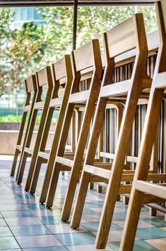 Bar stools or benches, with thick pasta floor, at the back vegetation, bar and Stock Photos