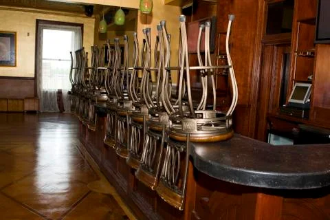 Bar stools stacked on the bar Stock Photos