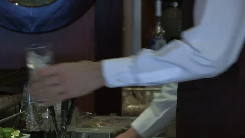 Bar tender preparing drink Stock Footage 81074398