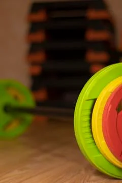 A bar with three multi-colored damn bar - red, yellow and green. In the gym Foto stock