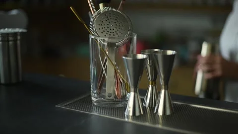 Bar Tools and Measuring Cups on a Countertop Stock Footage 278740375