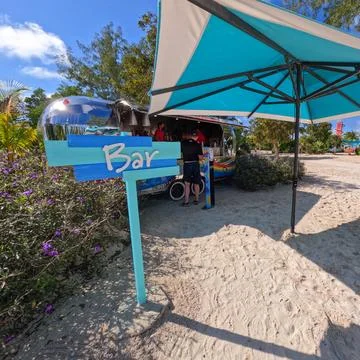 A bar in a trailer at Coco Cay which is Royal Caribbean Cruise Lines RCL pr.. Stock Photos