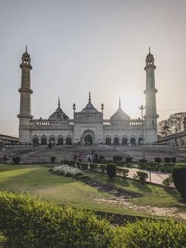 . The Bara Imambara, Historic white mosque with domes and tall minarets beside a Stock Photos