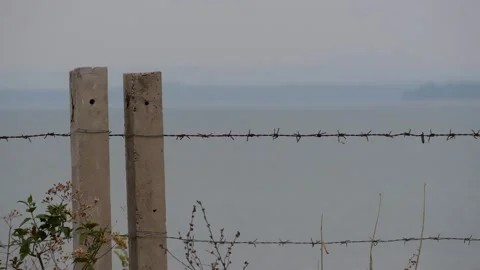 Barb wire with Beautiful blurry scene of water surface background, nice scene Stock Footage 151894449