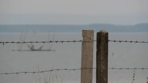 Barb wire with Beautiful blurry scene of water surface background, nice scene Stock Footage 151894497