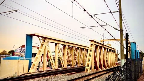 Barb wire over cream-coloured iron train bridge, Mt Lawley, Perth, WA Video stock 277336523